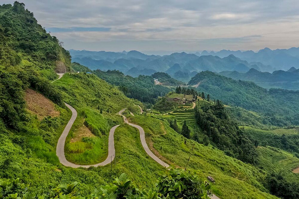 Panoramic views of limestone peaks, valleys, and drifting clouds from elevated vantage points